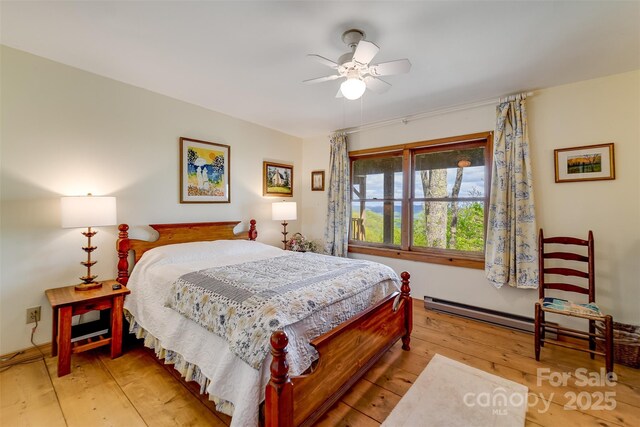 5271 Big Ridge Rd, Glenville, NC 28736 - bedroom with light wood finished floors and ceiling fan