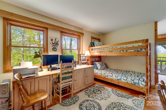 5271 Big Ridge Rd, Glenville, NC 28736 - bedroom featuring multiple windows, a desk, and wood finished floors