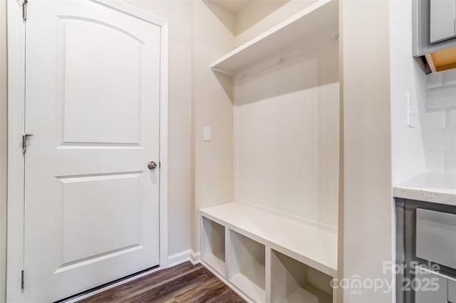mudroom with dark wood-style floors and baseboards