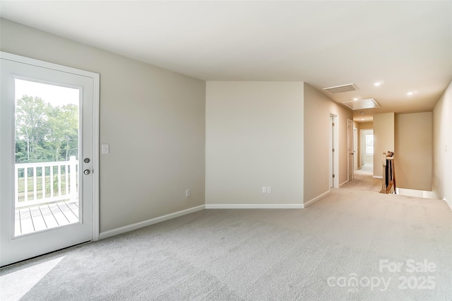 empty room featuring baseboards, carpet flooring, and recessed lighting