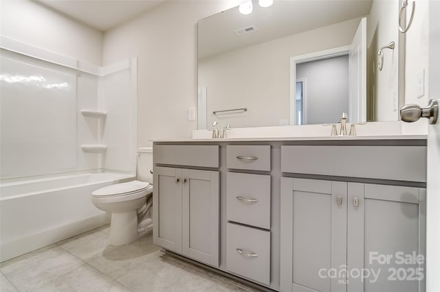 full bath featuring toilet, double vanity, tile patterned floors, and bathtub / shower combination