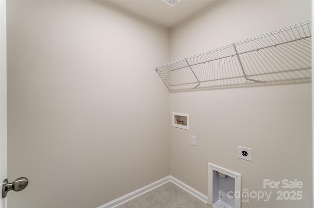 laundry area with hookup for an electric dryer, washer hookup, and baseboards