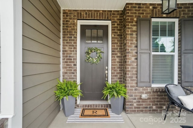 220 Forsythia Ln, Tega Cay, SC 29708 - doorway to property featuring brick siding and covered porch