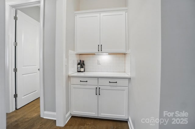 220 Forsythia Ln, Tega Cay, SC 29708 - bar with dark wood-style flooring, backsplash, and baseboards