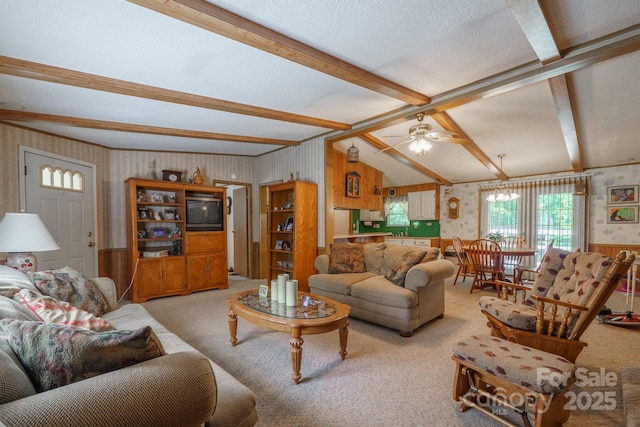 2310 Alexis Lucia Rd, Stanley, NC 28164 - living room with carpet, wallpapered walls, beam ceiling, ceiling fan, and wooden walls