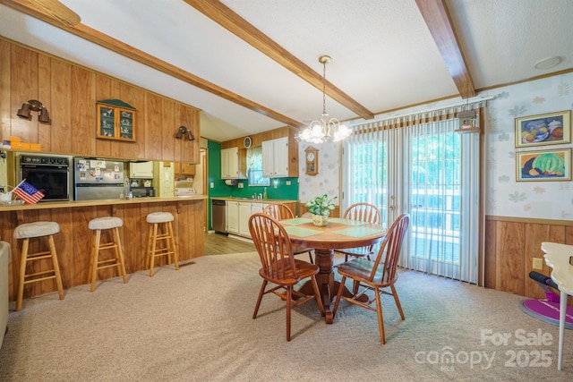 2310 Alexis Lucia Rd, Stanley, NC 28164 - dining room with beamed ceiling, wood walls, a chandelier, wainscoting, and light carpet