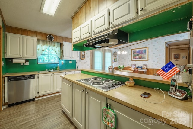 2310 Alexis Lucia Rd, Stanley, NC 28164 - kitchen featuring appliances with stainless steel finishes, wallpapered walls, white cabinets, light wood-style floors, and a sink