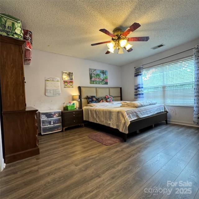 3012 Longspur Dr, Matthews, NC 28105 - bedroom featuring a textured ceiling, wood finished floors, ceiling fan, and baseboards