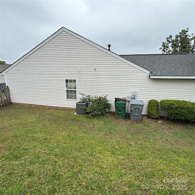 3012 Longspur Dr, Matthews, NC 28105 - view of home's exterior with roof with shingles, a lawn, and central air condition unit