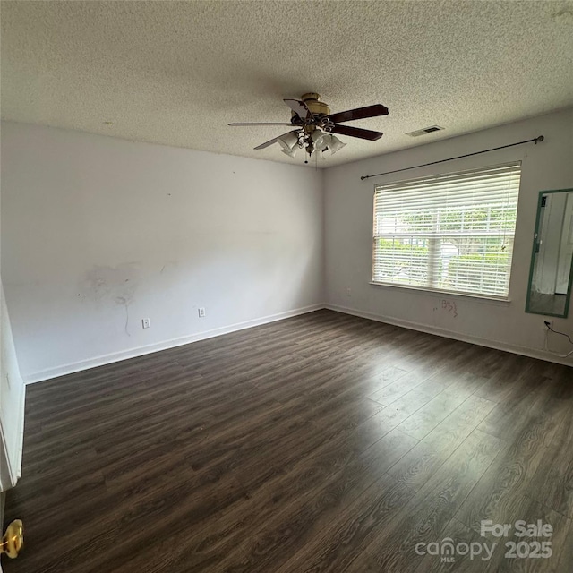 3012 Longspur Dr, Matthews, NC 28105 - unfurnished room with dark wood-style floors, a textured ceiling, ceiling fan, and baseboards