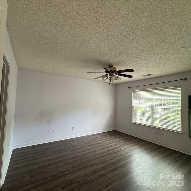 3012 Longspur Dr, Matthews, NC 28105 - unfurnished room featuring dark wood-style floors, ceiling fan, a textured ceiling, and baseboards