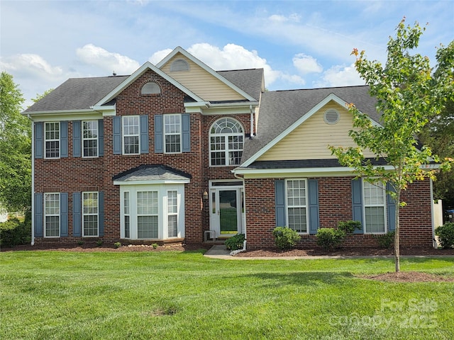 6017 Lowergate Dr, Waxhaw, NC 28173 - view of front of house with a front yard, brick siding, and a shingled roof