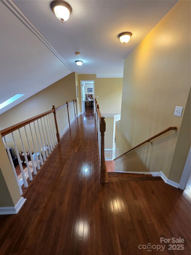 6017 Lowergate Dr, Waxhaw, NC 28173 - corridor featuring an upstairs landing, hardwood / wood-style flooring, baseboards, and vaulted ceiling