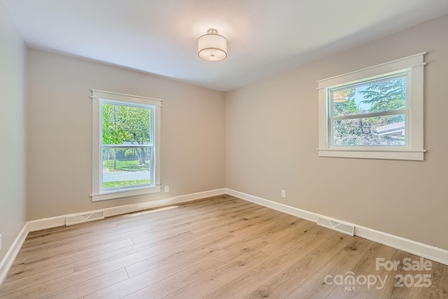 1515 Edgewater Dr, Charlotte, NC 28210 - unfurnished room with plenty of natural light, light wood-style floors, and baseboards