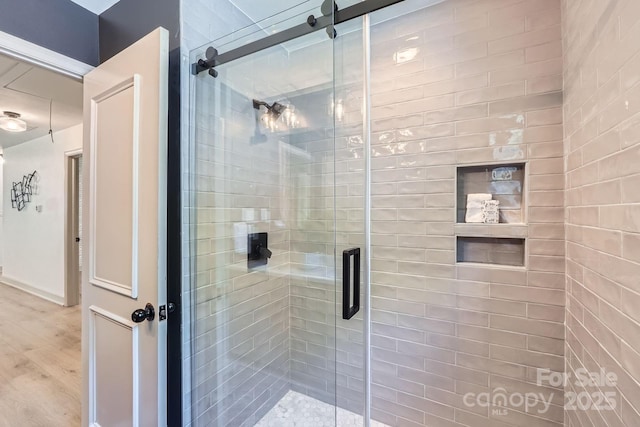 1515 Edgewater Dr, Charlotte, NC 28210 - bathroom featuring a shower stall and wood finished floors
