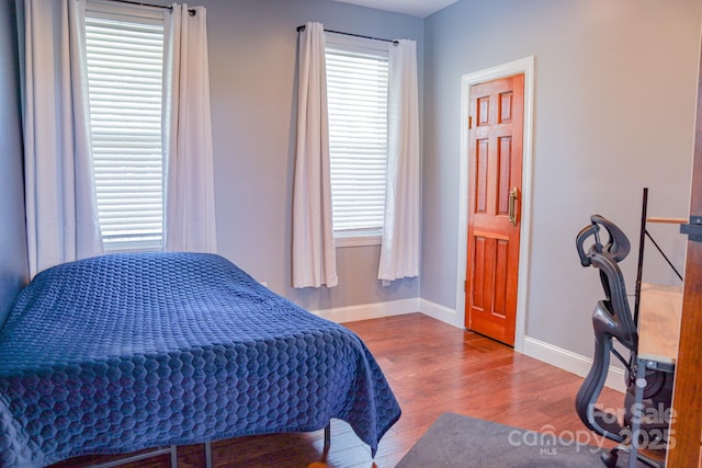 7768 Pinecone Ln, Hickory, NC 28602 - bedroom featuring baseboards and wood finished floors