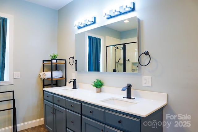 7768 Pinecone Ln, Hickory, NC 28602 - bathroom with a shower stall, double vanity, and baseboards