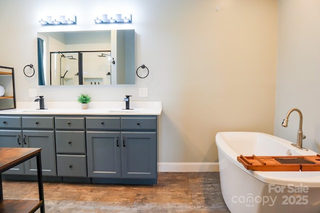 7768 Pinecone Ln, Hickory, NC 28602 - full bath with baseboards, a stall shower, double vanity, and a freestanding tub