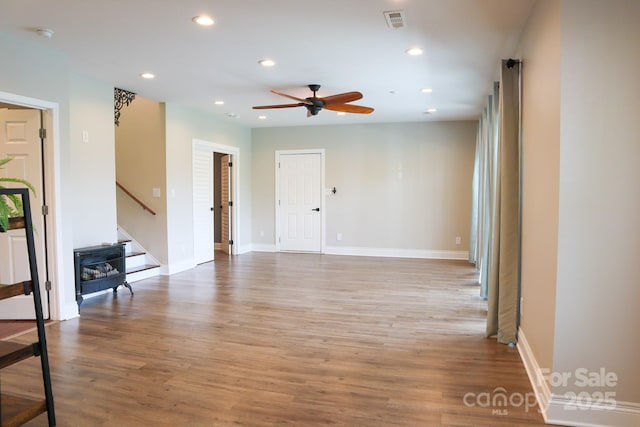 7768 Pinecone Ln, Hickory, NC 28602 - unfurnished room with a ceiling fan, recessed lighting, stairway, light wood-type flooring, and baseboards