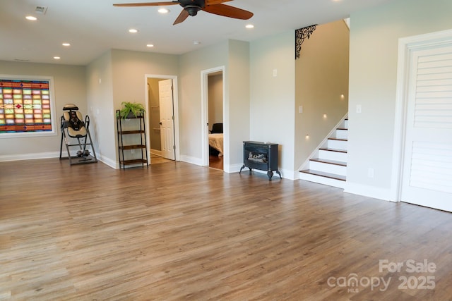 7768 Pinecone Ln, Hickory, NC 28602 - living room featuring ceiling fan, stairway, wood finished floors, recessed lighting, and baseboards