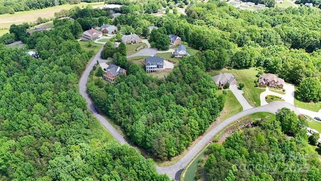 7768 Pinecone Ln, Hickory, NC 28602 - aerial view of property and surrounding area featuring a heavily wooded area