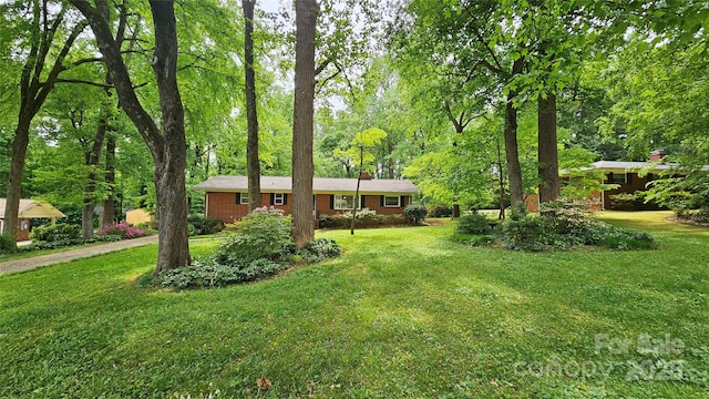 7021 Linda Lake Dr, Charlotte, NC 28215 - single story home with a front yard and a chimney