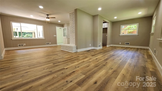 7021 Linda Lake Dr, Charlotte, NC 28215 - spare room with baseboards, wood finished floors, a ceiling fan, and recessed lighting