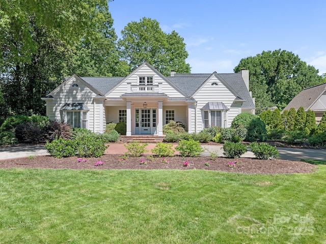 2410 Vernon Dr, Charlotte, NC 28211 - view of front of home featuring a front yard, french doors, a chimney, and a shingled roof