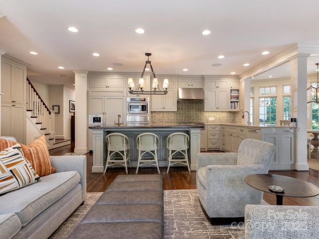 2410 Vernon Dr, Charlotte, NC 28211 - living room with a chandelier, dark wood-type flooring, recessed lighting, and stairs
