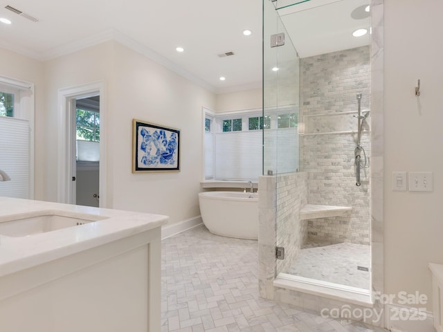 2410 Vernon Dr, Charlotte, NC 28211 - full bathroom with a shower stall, a freestanding bath, vanity, ornamental molding, and recessed lighting