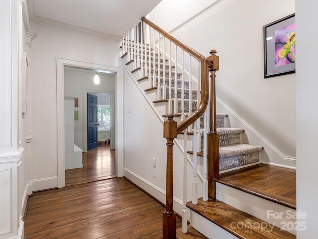 2410 Vernon Dr, Charlotte, NC 28211 - stairway featuring wood finished floors and ornamental molding