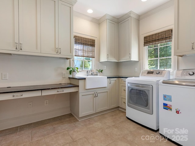2410 Vernon Dr, Charlotte, NC 28211 - laundry room with separate washer and dryer, cabinet space, and crown molding