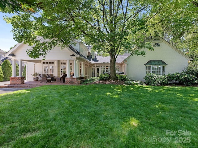 2410 Vernon Dr, Charlotte, NC 28211 - rear view of property featuring a yard and a patio area