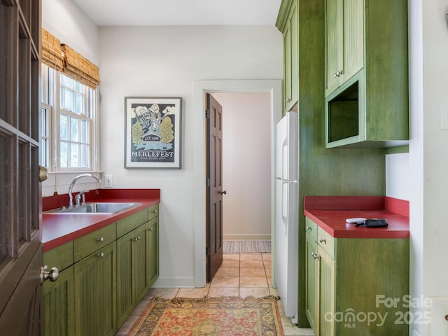 2410 Vernon Dr, Charlotte, NC 28211 - kitchen with green cabinets, freestanding refrigerator, and dark countertops