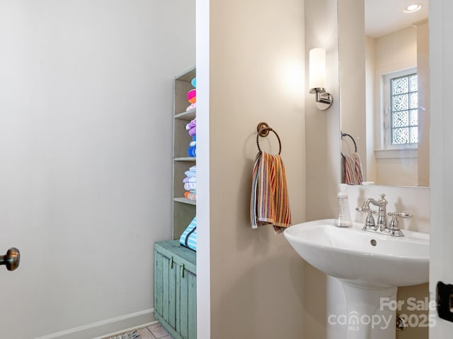 2410 Vernon Dr, Charlotte, NC 28211 - bathroom featuring baseboards and a sink