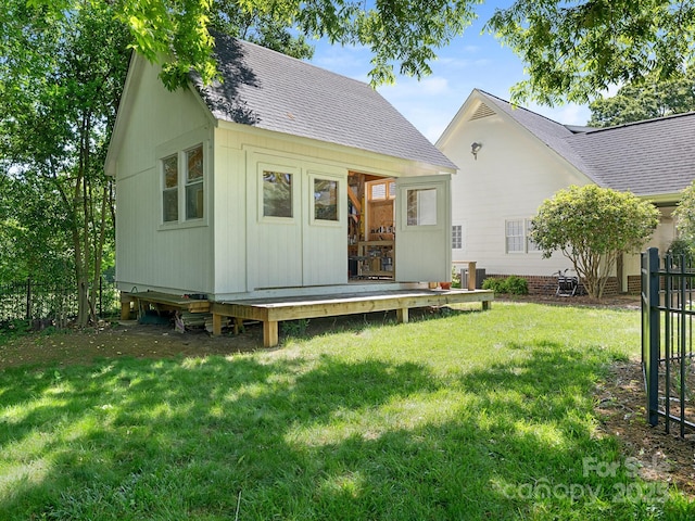 2410 Vernon Dr, Charlotte, NC 28211 - back of house featuring roof with shingles and an outbuilding