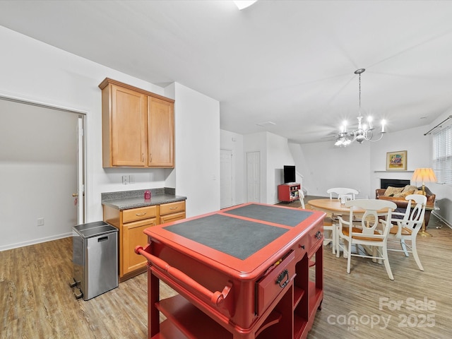 2306 Nettleton Ct, Matthews, NC 28105 - kitchen featuring open shelves, a chandelier, open floor plan, and light wood-type flooring