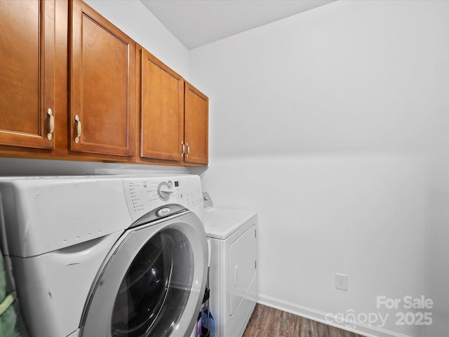 2306 Nettleton Ct, Matthews, NC 28105 - laundry room featuring cabinet space, washing machine and dryer, dark wood-type flooring, and baseboards