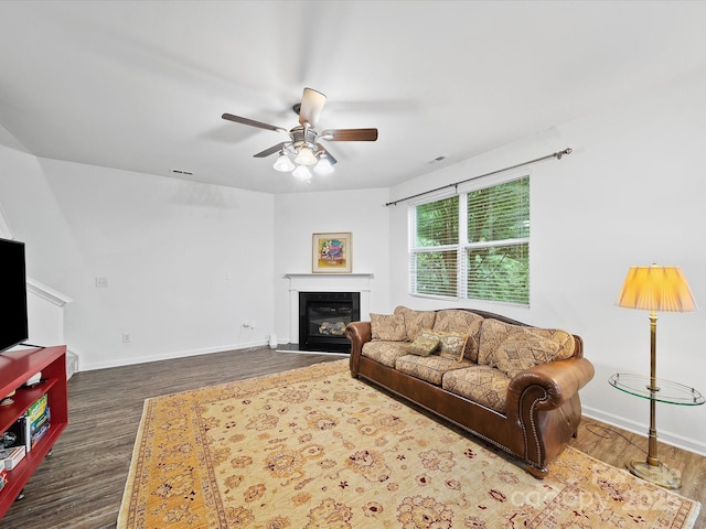 2306 Nettleton Ct, Matthews, NC 28105 - living room featuring dark wood-type flooring, ceiling fan, baseboards, and a glass covered fireplace