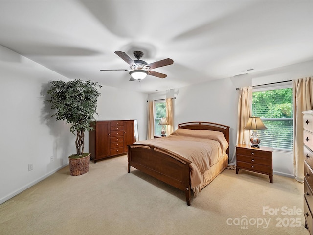 2306 Nettleton Ct, Matthews, NC 28105 - bedroom with light colored carpet, a ceiling fan, and baseboards