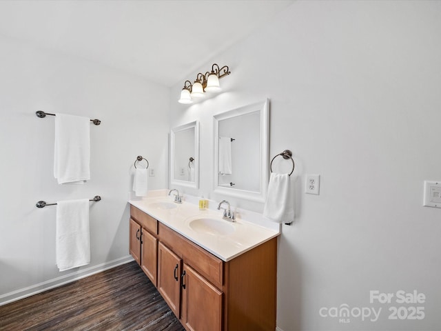 2306 Nettleton Ct, Matthews, NC 28105 - bathroom with double vanity, wood finished floors, and baseboards