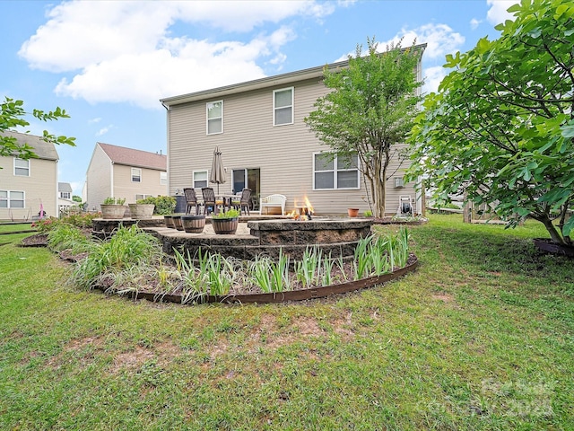 2306 Nettleton Ct, Matthews, NC 28105 - rear view of property with a fire pit and a lawn