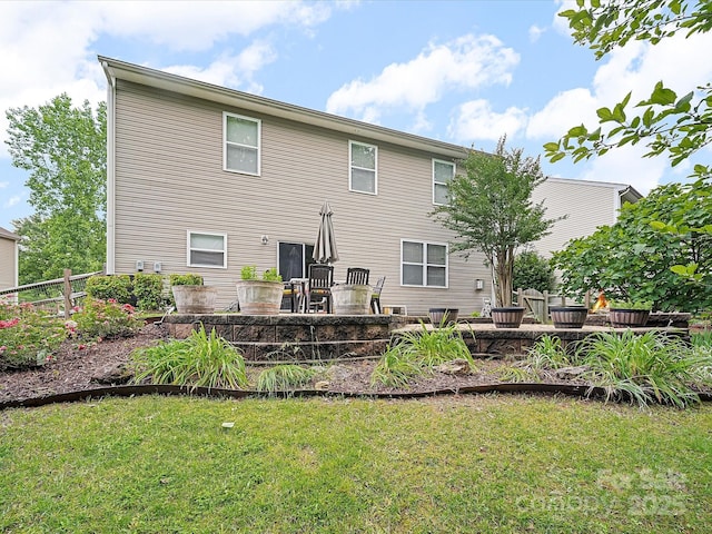 2306 Nettleton Ct, Matthews, NC 28105 - rear view of property featuring a lawn and a patio