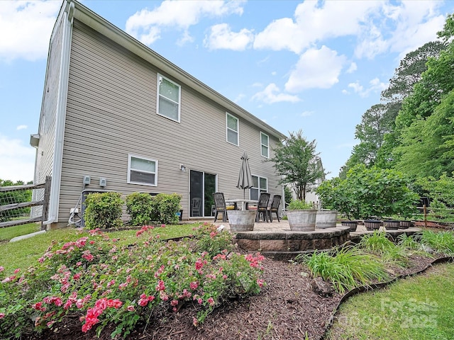 2306 Nettleton Ct, Matthews, NC 28105 - back of property featuring a patio, an outdoor fire pit, and fence