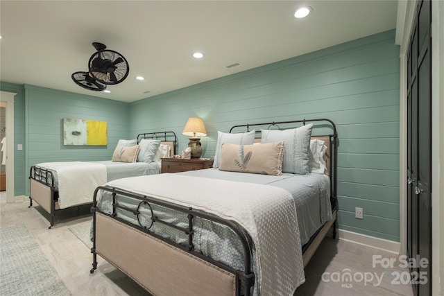 973 Sitting Rock Trl, Cullowhee, NC 28723 - bedroom with recessed lighting, baseboards, and wood walls