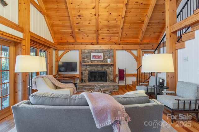 973 Sitting Rock Trl, Cullowhee, NC 28723 - living room featuring wood ceiling, wood finished floors, wood walls, a fireplace, and stairway