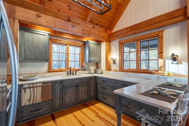 973 Sitting Rock Trl, Cullowhee, NC 28723 - kitchen featuring a sink, light wood-type flooring, plenty of natural light, light stone countertops, and wooden ceiling