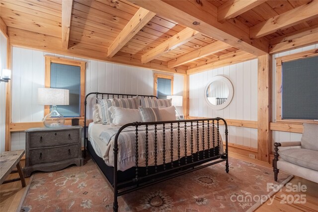 973 Sitting Rock Trl, Cullowhee, NC 28723 - bedroom with wood ceiling with exposed beams, wooden walls, and wood finished floors