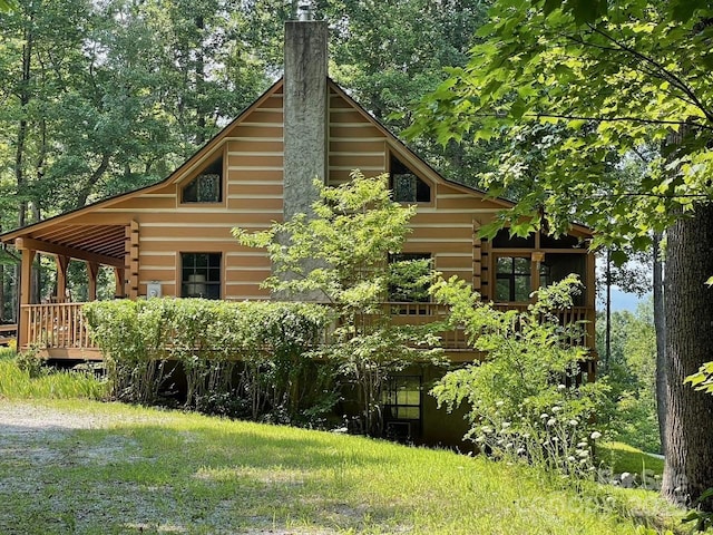 178 Tablerock Dr, Saluda, NC 28773 - view of side of home with a chimney and a deck