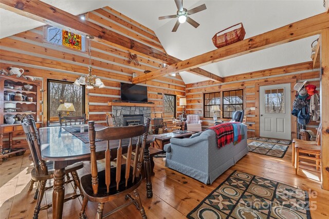 178 Tablerock Dr, Saluda, NC 28773 - living room with hardwood / wood-style flooring, a ceiling fan, a fireplace, a chandelier, and wood walls